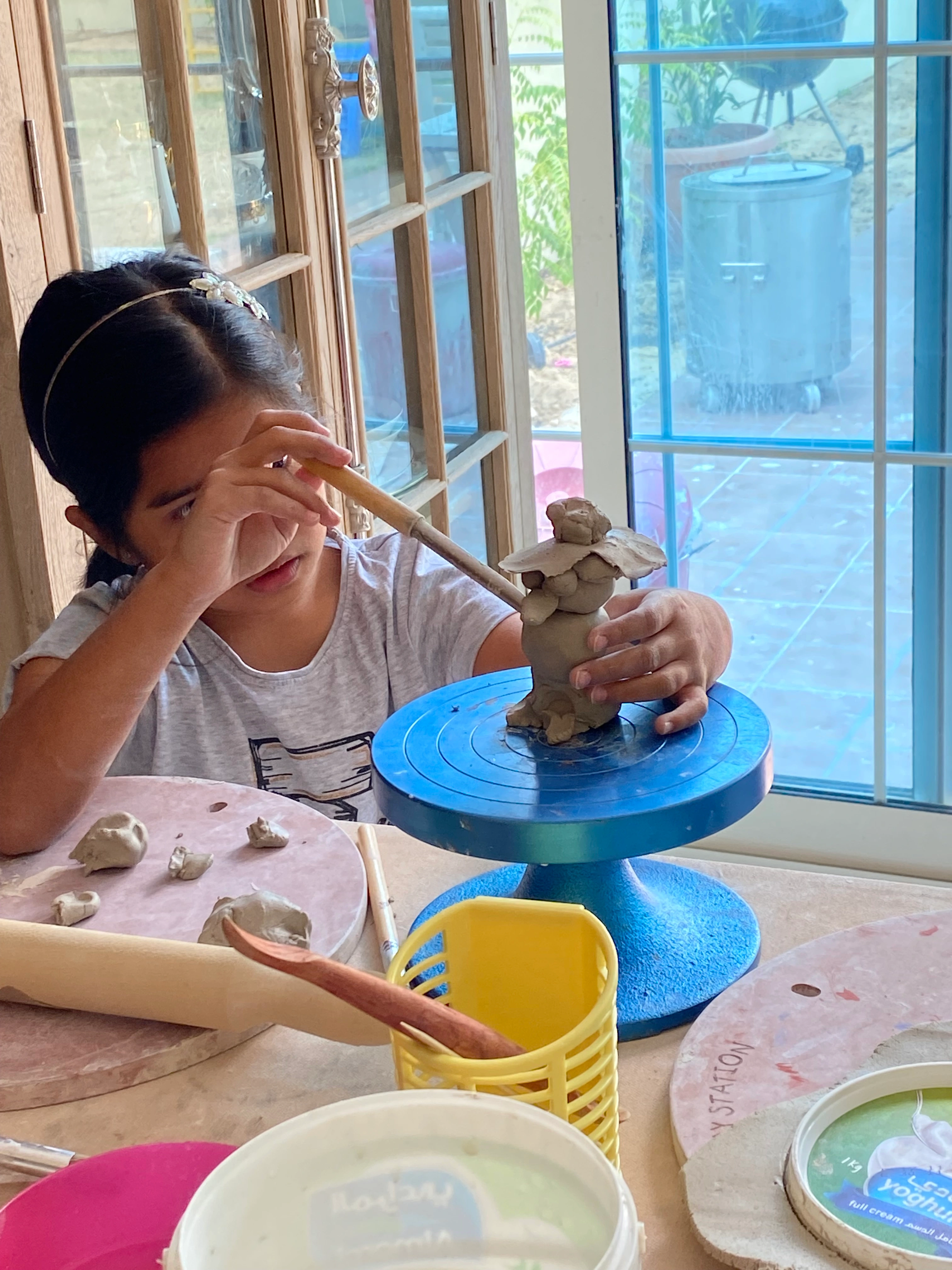 Workshop hero - mother and child making pottery